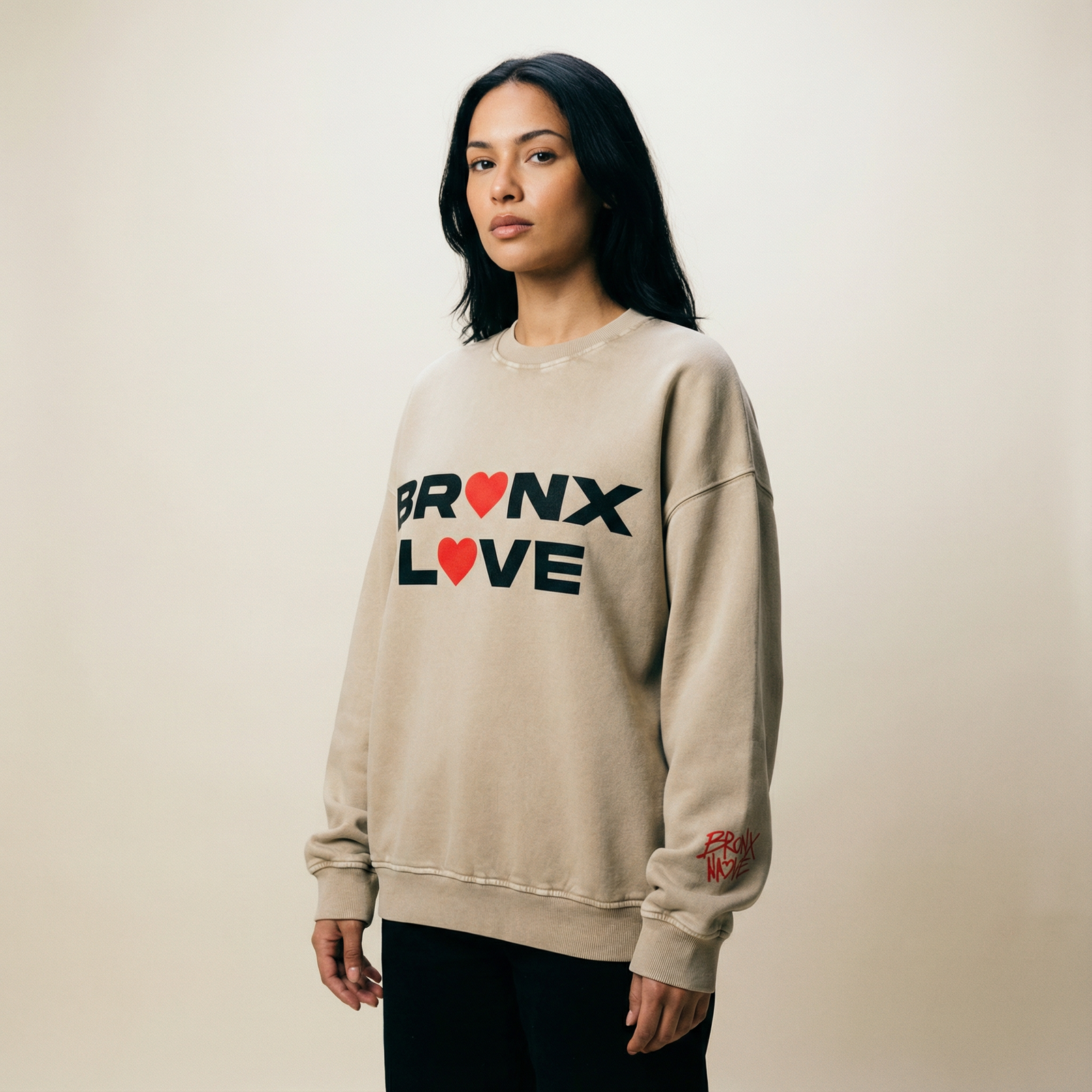 Woman in a modern streetwear outfit outdoors with soft natural light and an uncluttered city background