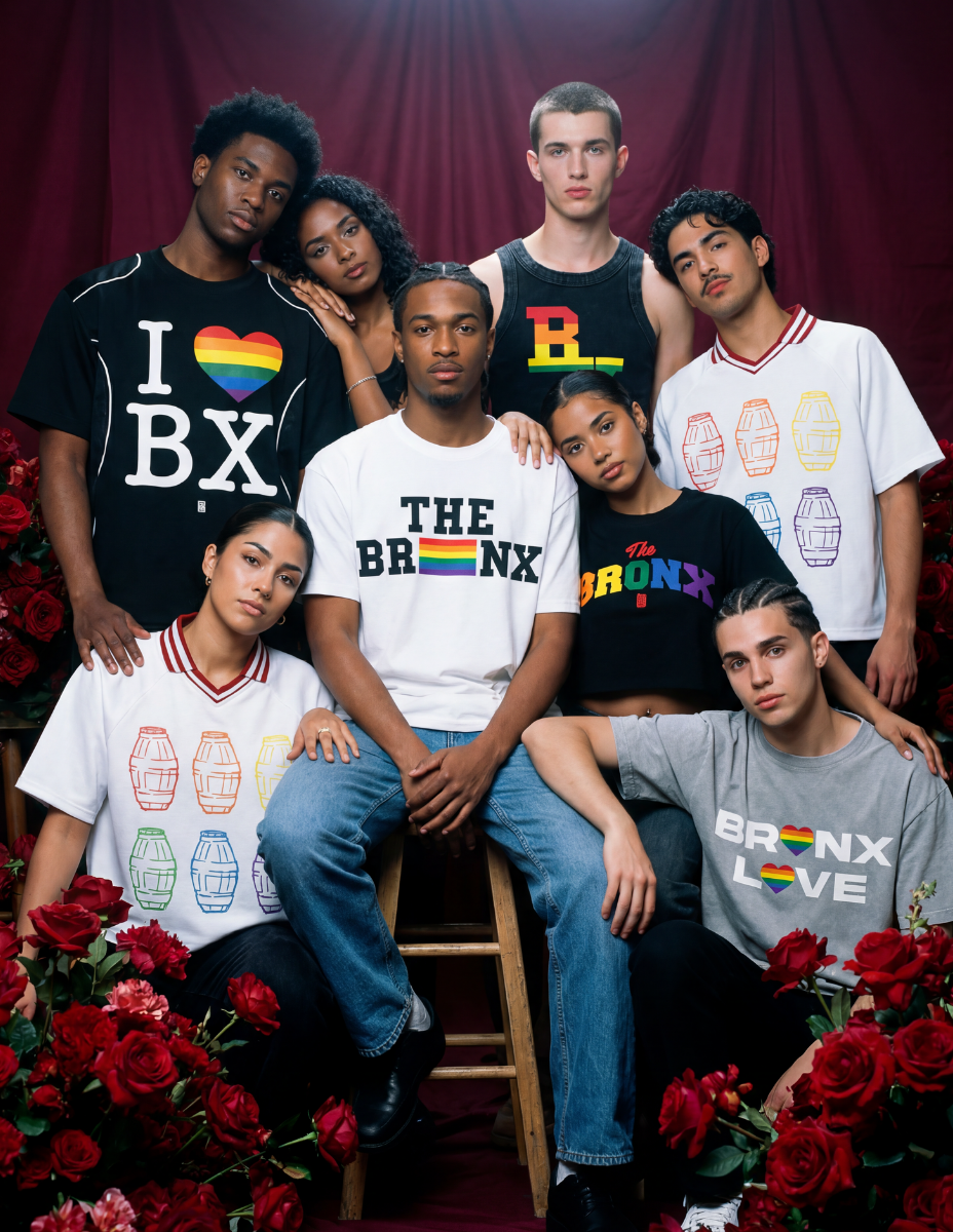 Casual streetwear and accessories in pride-inspired colors arranged on a clean urban backdrop