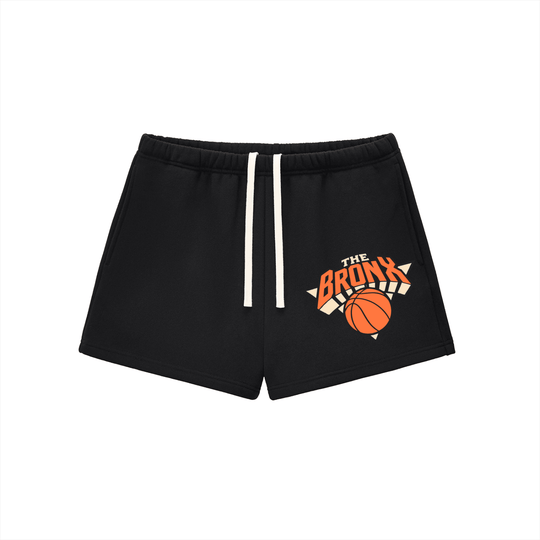 Black Bronx streetwear shorts with orange basketball graphic and 'The Bronx' text, NYC-inspired athletic wear