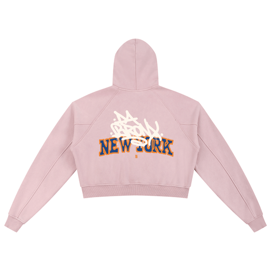 Pink cropped hoodie with 'Bronx New York' graffiti design, bold streetwear style