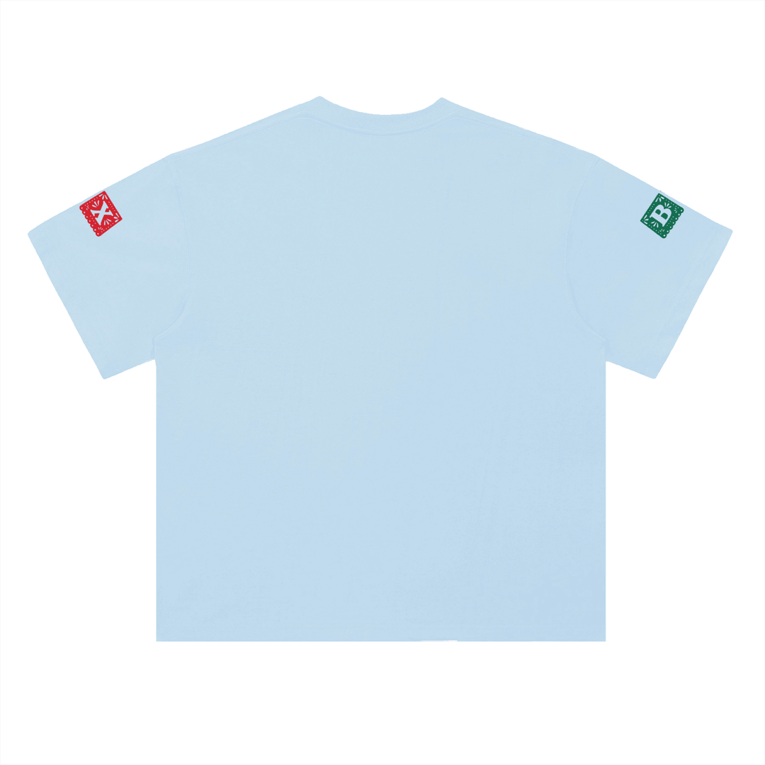 Light blue t-shirt with red and green sleeve patches, NYC streetwear style
