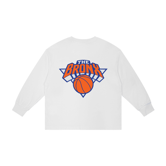White long sleeve tee with 'The Bronx' basketball graphic, bold streetwear design inspired by NYC culture