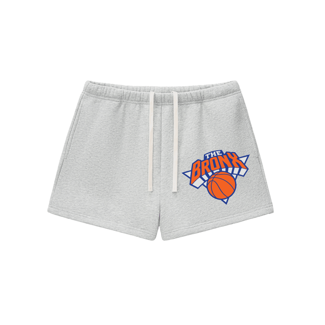Gray Bronx basketball shorts with 'The Bronx' graphic and orange ball, NYC streetwear style