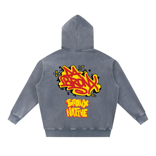 Gray hoodie with bold yellow graffiti text 'Da Bronx' and 'Bronx Native' on the back, streetwear style