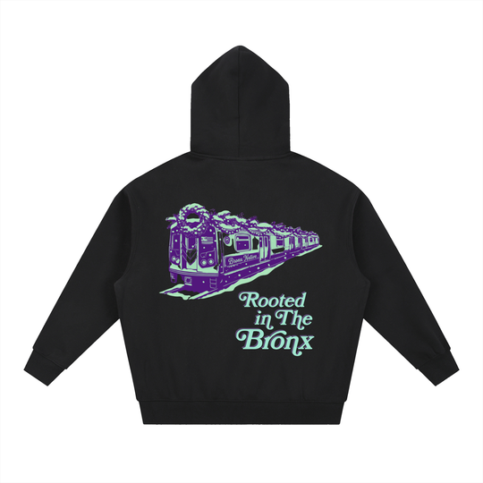 Black hoodie with a purple train graphic and 'Rooted in The Bronx' text on the back, on a white background.