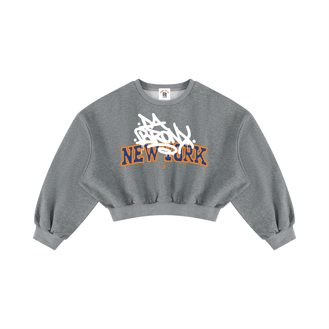 Grey cropped hoodie with 'Bronx New York' graffiti-style graphic, bold streetwear inspired by NYC culture.