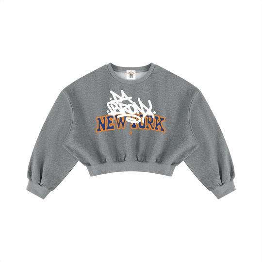 Grey cropped hoodie with 'Bronx New York' graffiti-style graphic, bold streetwear inspired by NYC culture.