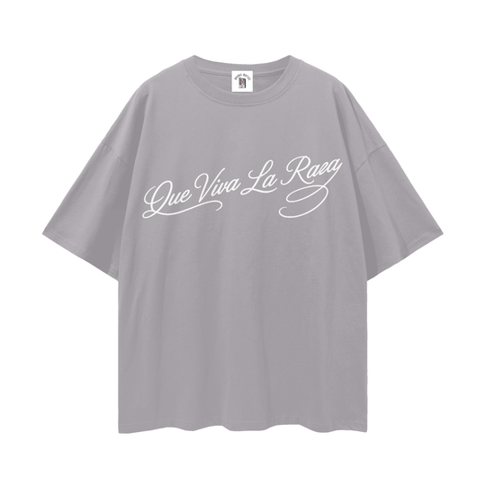 Gray oversized tee with 'Que Viva La Raza' script, bold streetwear inspired by NYC culture