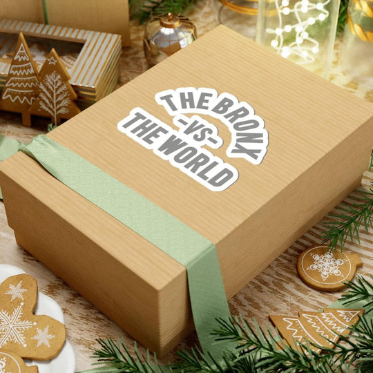 The Bronx vs The World sticker on gift box with holiday cookies and greenery, NYC streetwear style