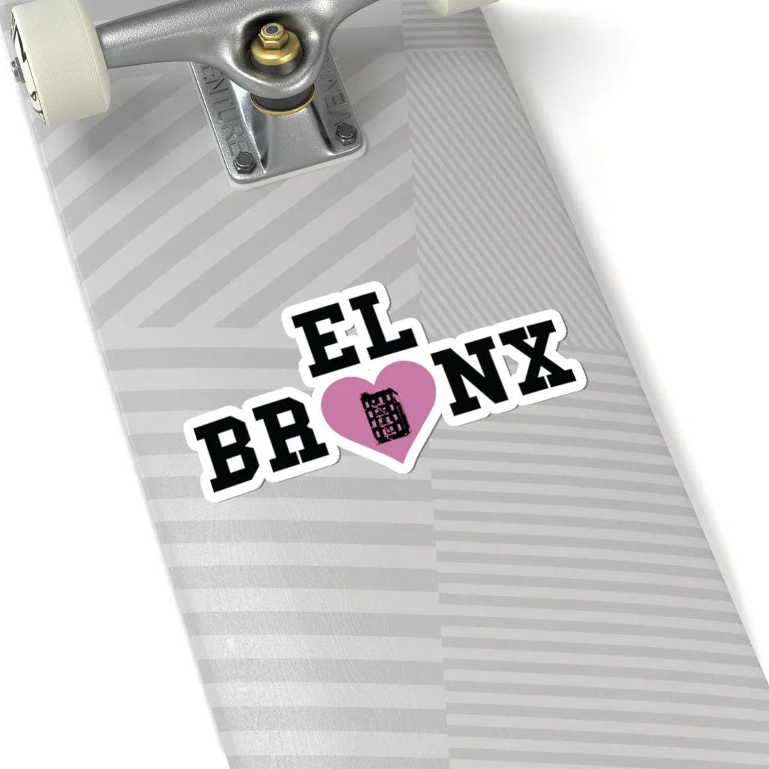 El Bronx sticker with pink heart on gray striped skateboard deck, NYC streetwear style