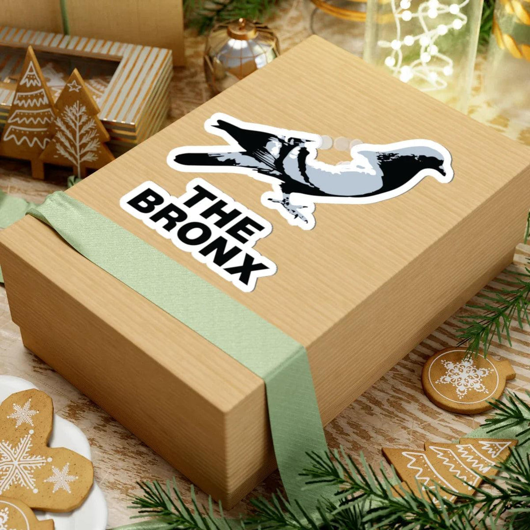 The Bronx sticker with pigeon design on gift box, holiday decor, gingerbread, festive ribbon