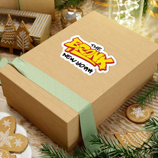 The Bronx New York sticker on gift box with holiday decor, gingerbread, and green ribbon