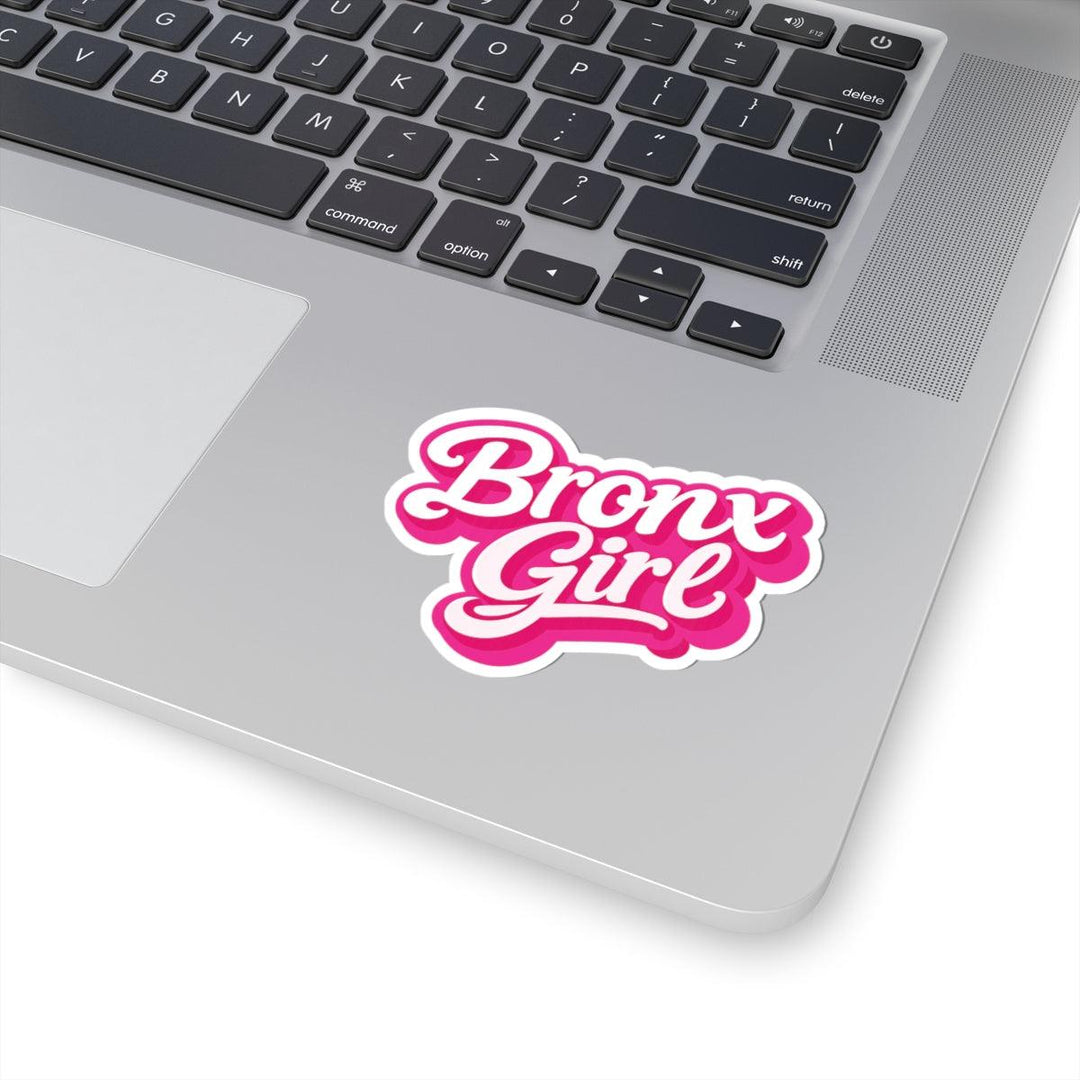 Pink 'Bronx Girl' sticker on silver laptop, bold NYC streetwear style