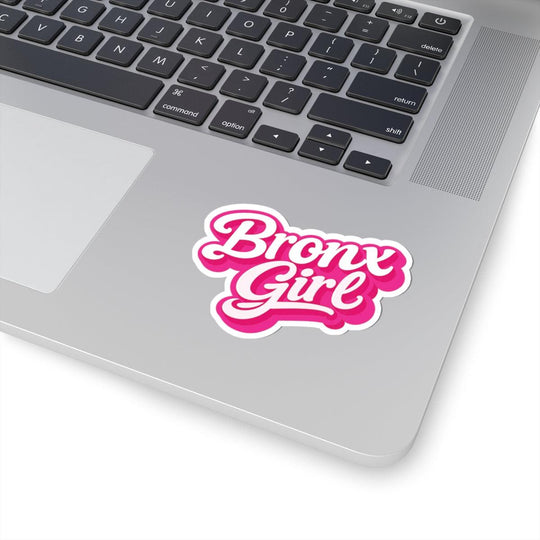 Pink 'Bronx Girl' sticker on silver laptop, bold NYC streetwear style