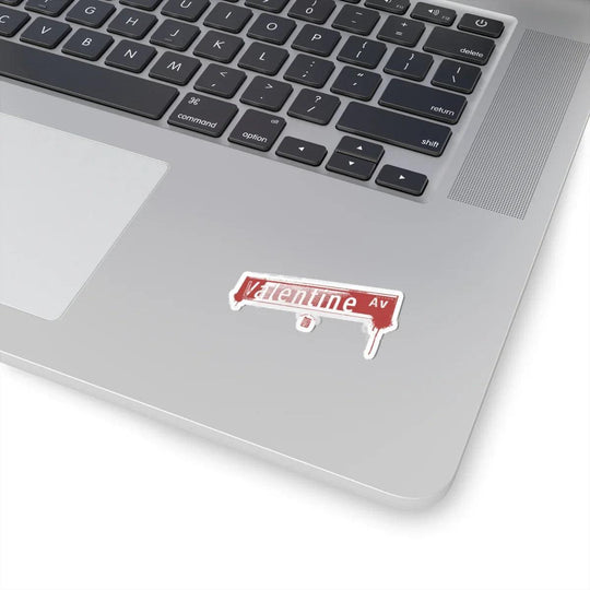 Valentine Av street sign sticker on laptop, NYC-inspired urban decor for tech gear
