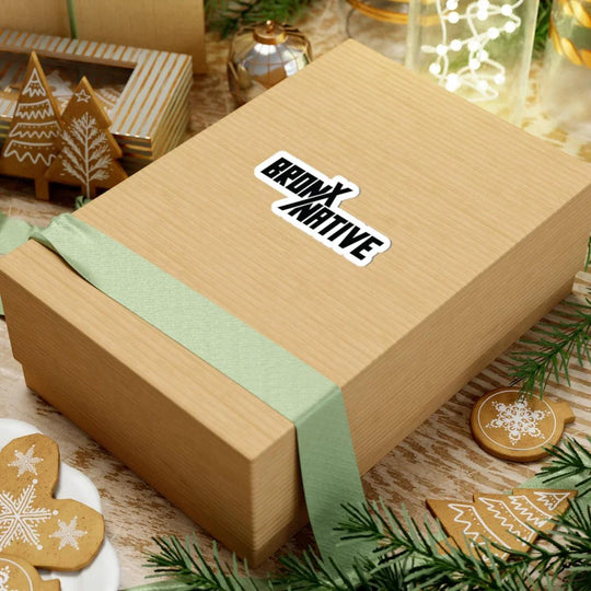 Bronx Native sticker on gift box with holiday decor, gingerbread cookies, and green ribbon