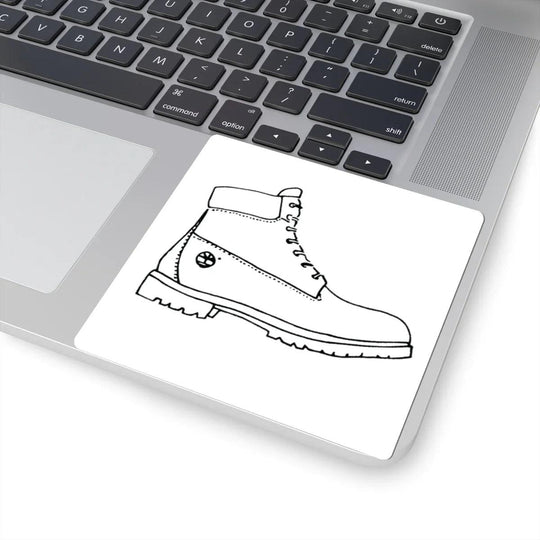 Stylized boot illustration on laptop touchpad, NYC-inspired streetwear design