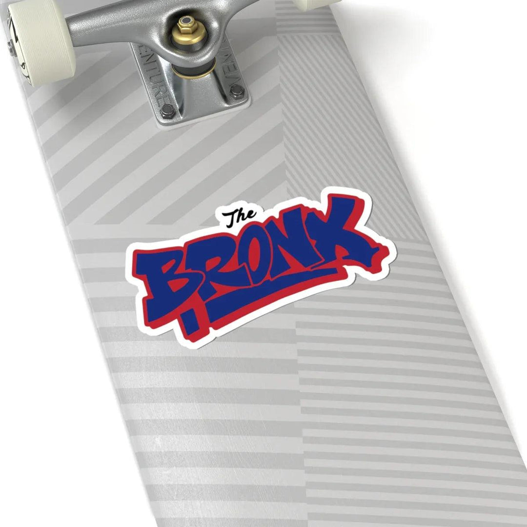 The Bronx sticker on gray striped skateboard deck with silver trucks