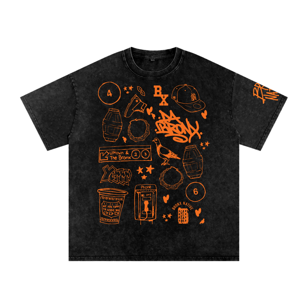 Black t-shirt with orange Bronx-themed graphic prints including graffiti, pigeon, phone booth, and Uptown subway sign