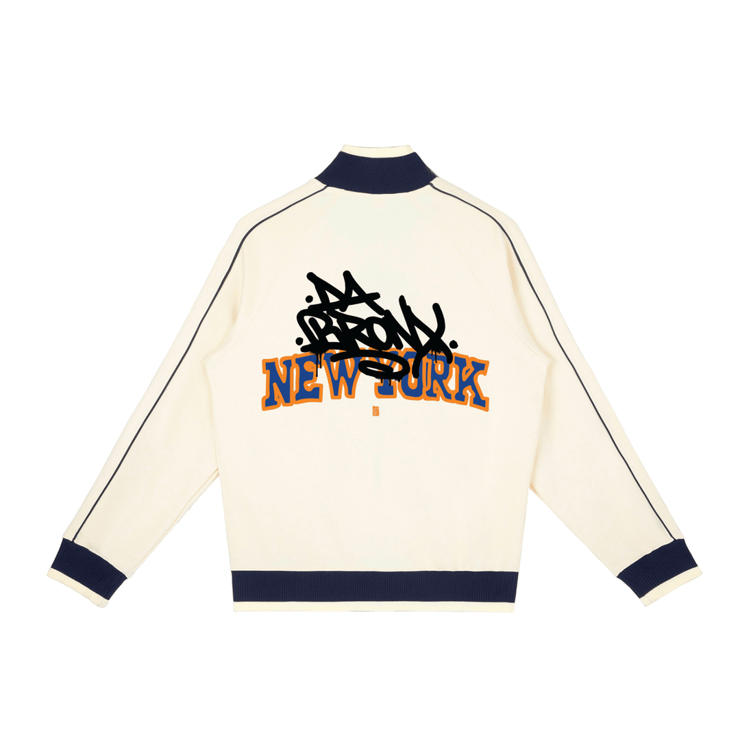 Cream-colored jacket with 'New York' text and black design on a white background