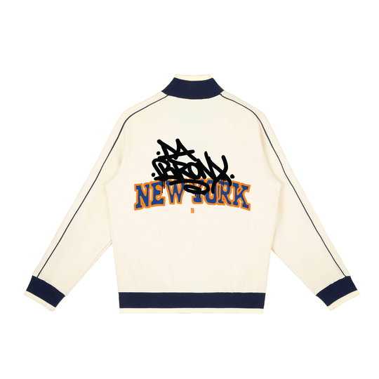 Cream-colored jacket with 'New York' text and black design on a white background
