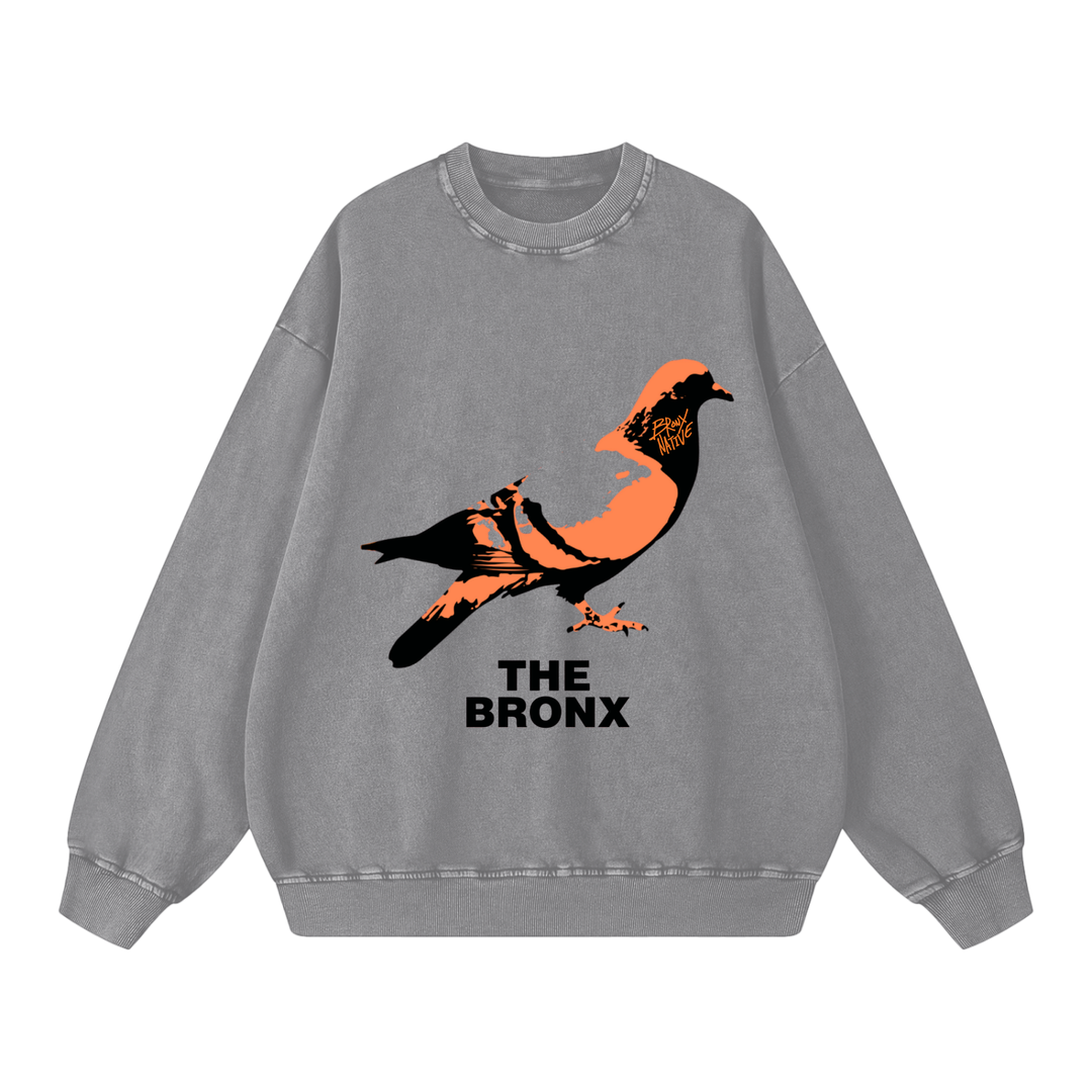 Gray sweatshirt with a pigeon graphic and 'The Bronx' text on a white background